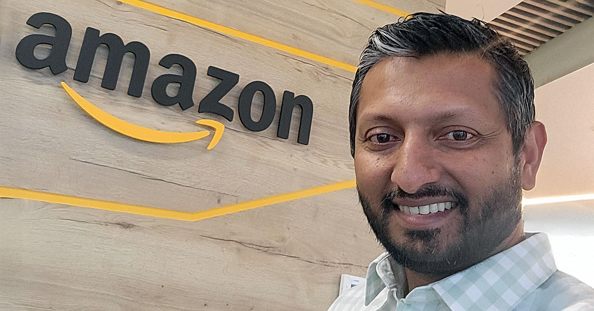 Lalindra (Lali) Jayatilleke in front of the Amazon sign